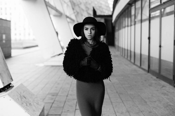 Gorgeous young brunette woman in fashionable hat posing - Valokuva, kuva