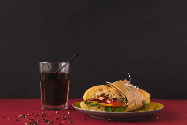panini with vegetables and glass of cola on table - Foto, immagini