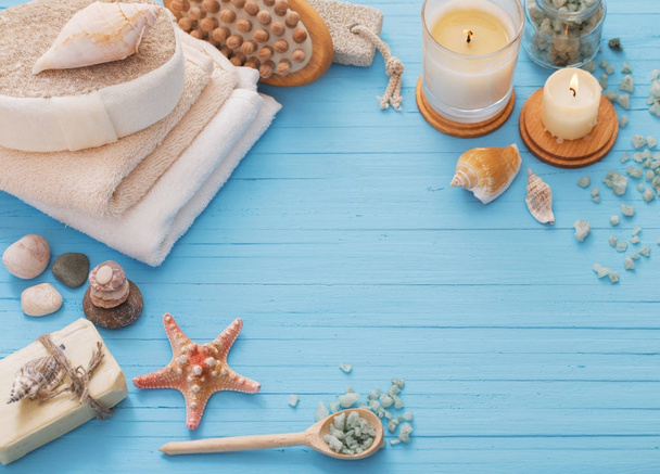 Spa concept with candles on blue wooden background - Photo, Image