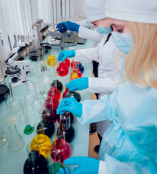 Science technicians at work in the laboratory. Medical background - Photo, Image