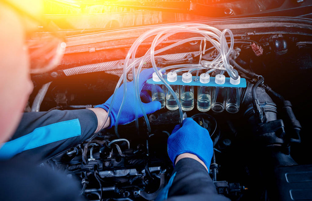 Cleaning engine injectors. Car repair. Service station. - Фото, изображение
