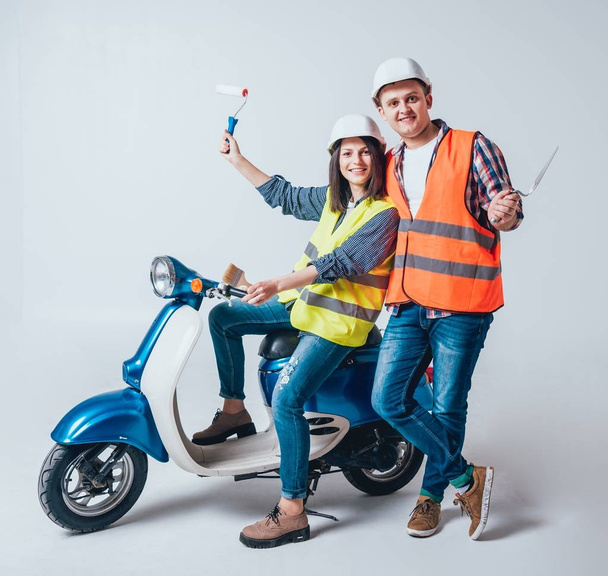 Happy young couple on motorbike. Shopping for the construction and repair for new home concept. - Valokuva, kuva