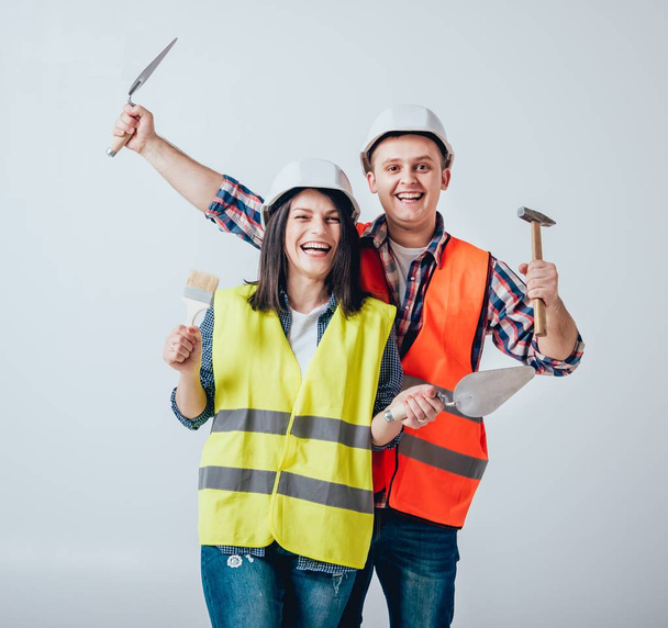 Happy couple making repairs to their home. Home renovation. - Fotó, kép