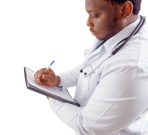 African american doctor posing with clipping pad, isolated on white - 写真・画像