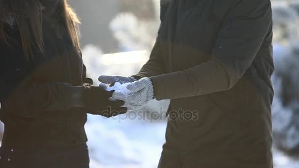 Happy couple playful together during winter holidays vocation outside in snow park - Video