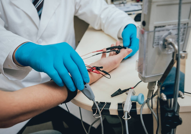 Patient nerves testing using electromyography. Medical examination. EMG - Фото, изображение