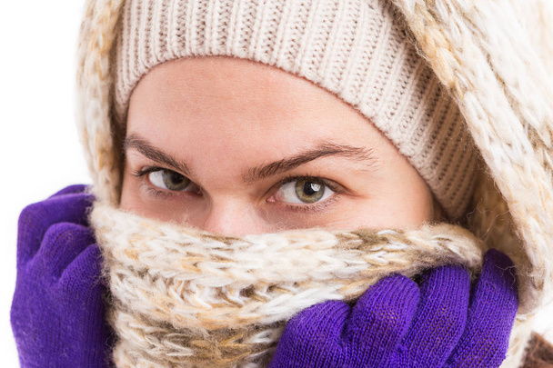 Beautiful green eyes of a woman wearing warm winter clothes - Photo, Image