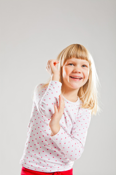 Happy smiling young girl with raised hands - Photo, Image