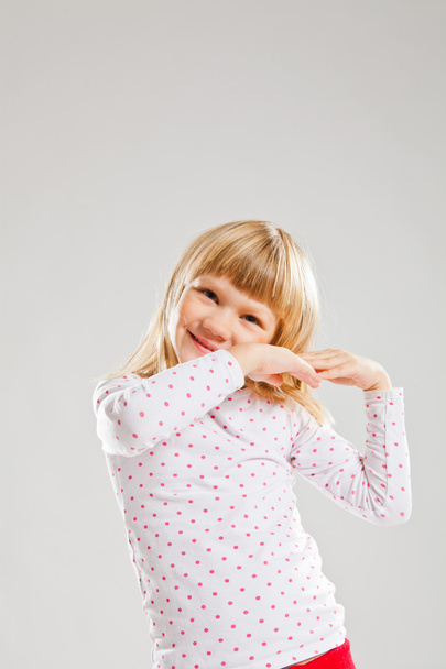 Happy smiling young girl with raised hands - 写真・画像