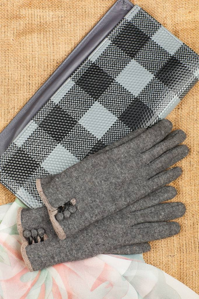 Scarf, handbag and gloves isolated on linen background. - Photo, Image