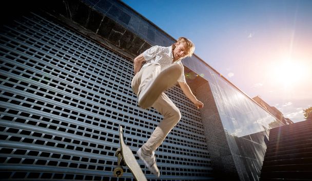 Skateboarder practicing and jumping on the streets - Φωτογραφία, εικόνα