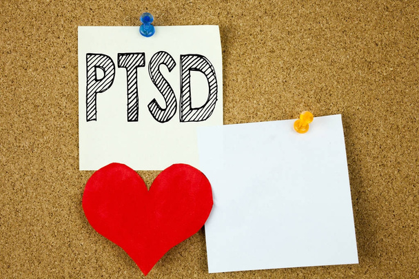 Conceptual hand writing text caption inspiration showing PTSD Post-Traumatic Stress Disorder  concept for Health Treatment and Love written on sticky note, reminder cork background with copy space - Photo, Image