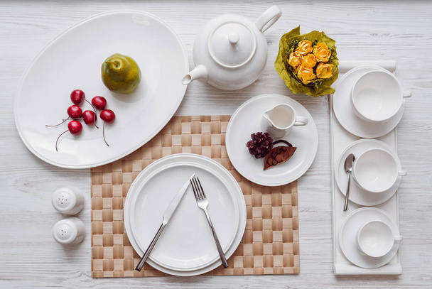 Served and decorated table with white tableware - Photo, image