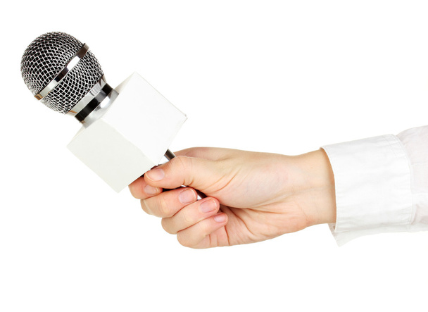 Female hand with microphone isolated on white - Zdjęcie, obraz