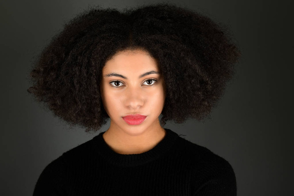 Young black woman with afro hairstyle smiling.  - Photo, Image