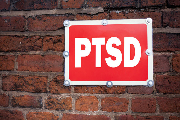 Hand writing text caption inspiration showing PTSD Post-Traumatic Stress Disorder  concept meaning Health Treatment written on old announcement road sign with background and copy space - Photo, Image