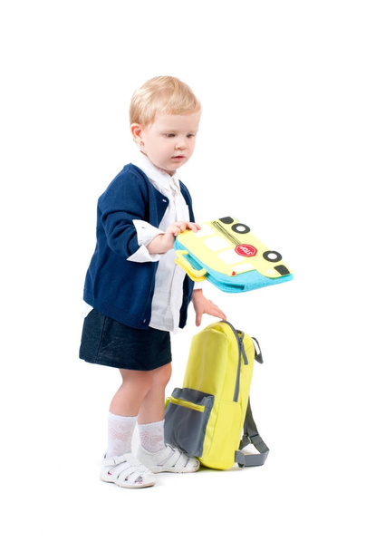 Happy little schoolgirl. Child with backpack and books. - Φωτογραφία, εικόνα