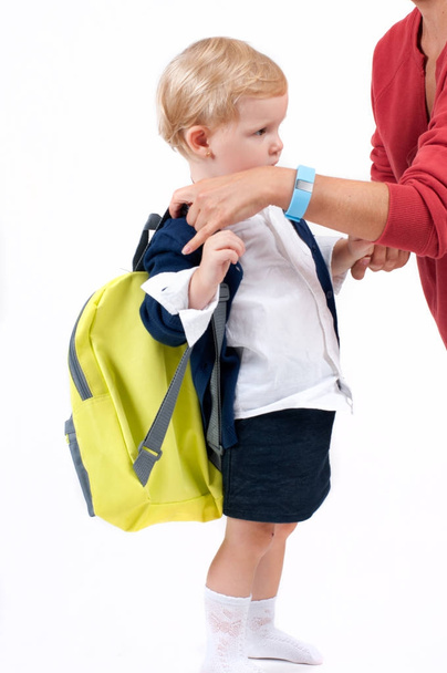 Happy little schoolgirl. Child with backpack and books. - Valokuva, kuva