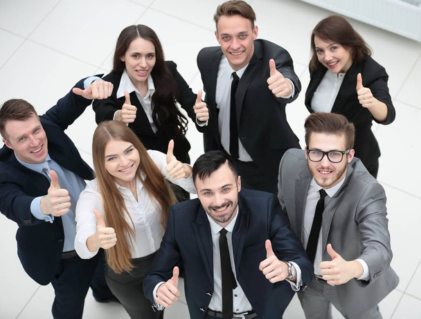 successful business team holding up a thumbs up - Foto, imagen