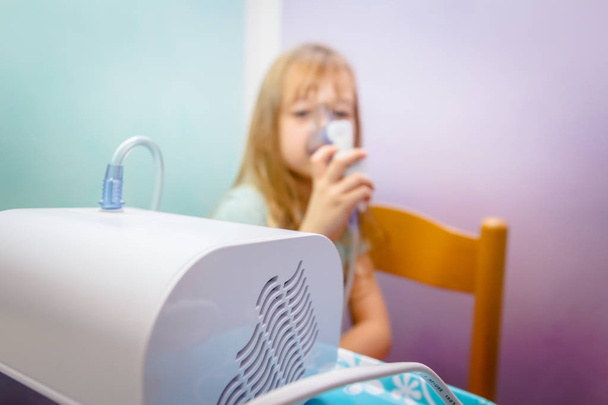 Portrait of sweet little girl using an inhaler  - Φωτογραφία, εικόνα