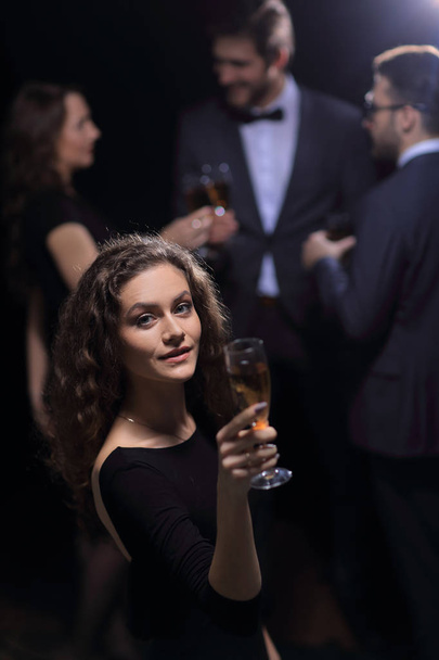 stylish young woman with glass of champagne - Фото, зображення