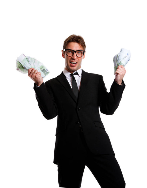 Photo of businessman in suit with money at hands - Fotó, kép