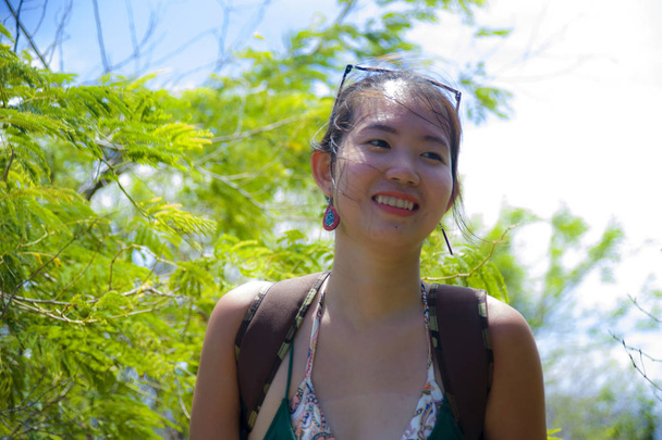happy Asian Chinese woman trekking and backpacker hiking excursion trip on tropical mountain enjoying nature smiling cheerful - Photo, Image