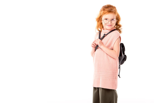 red hair kid with backpack looking at camera isolated on white - Foto, imagen