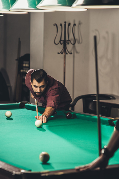 successful man playing in russian pool at bar with friend - Φωτογραφία, εικόνα
