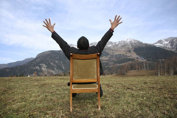 freedom man sits on a chair into the wild - Fotografie, Obrázek