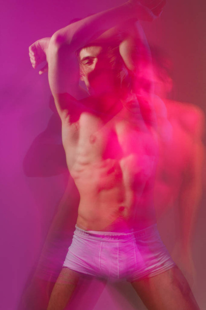 Male portrait of a dancer with a double exposure in the studio - Foto, imagen