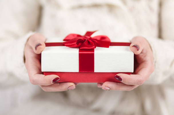 Present box in womans hands - Foto, imagen