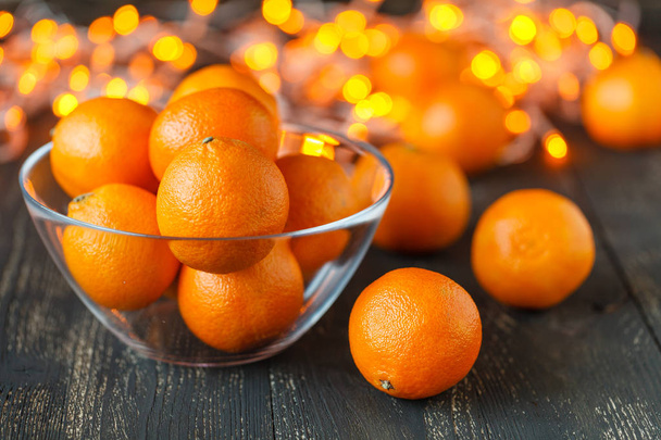 Fresh tangerine clementines with spices on dark wooden background, Christmas concept. - Photo, Image