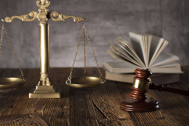 Judge antique gavel. Law symbols. Legal office. Wooden rustic table and stone background. - Photo, Image