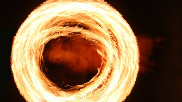 Fire poi show in the dark - fire rounds in speed - Photo, image