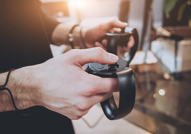 Mans hands with gamepads, selective focus - Foto, immagini