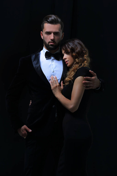 portrait of fashion couple on black background - Foto, Imagem
