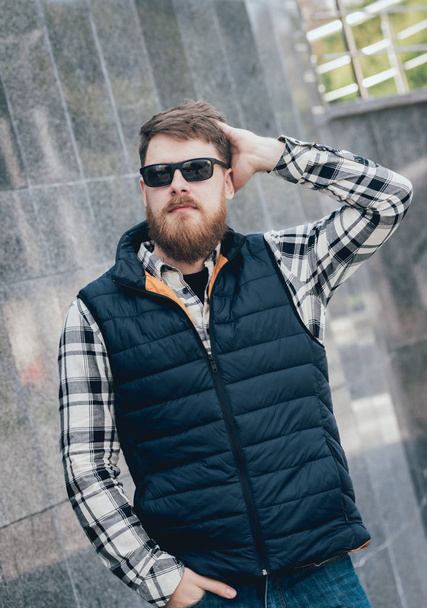 Handsome bearded man in casual clothes posing on camera. - Fotó, kép