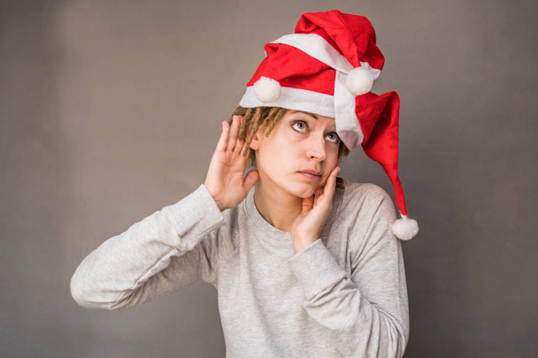 christmas young woman listening - Photo, Image