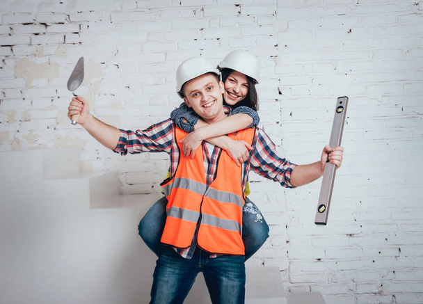 Happy couple making repairs to their home. Home renovation. - Valokuva, kuva