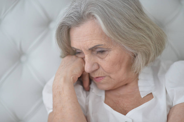 Portrait of a beautiful sad elderly woman close-up - Foto, Bild