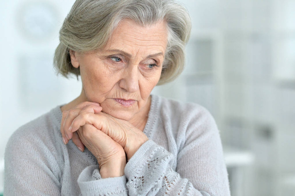 Portrait of a beautiful sad elderly woman close-up - Foto, imagen