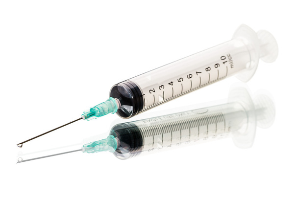 Syringe on white - Foto, Bild