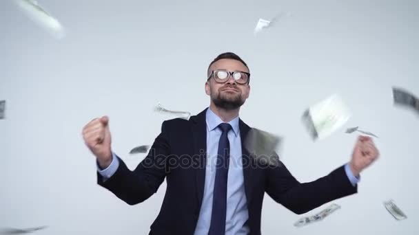 Slow motion of dollars falling on formally dressed man - Imágenes, Vídeo