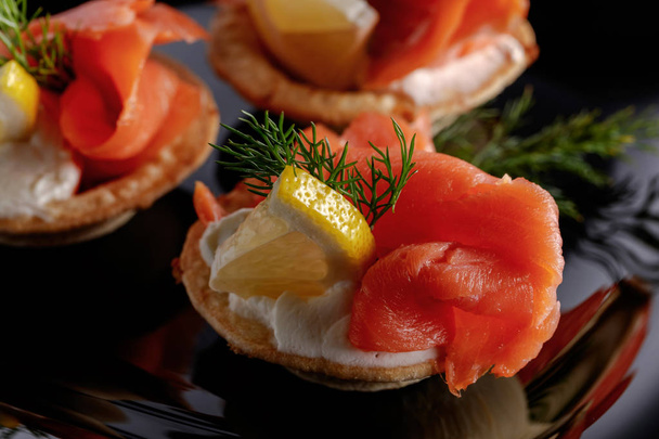 Tartlets with salmon. - 写真・画像