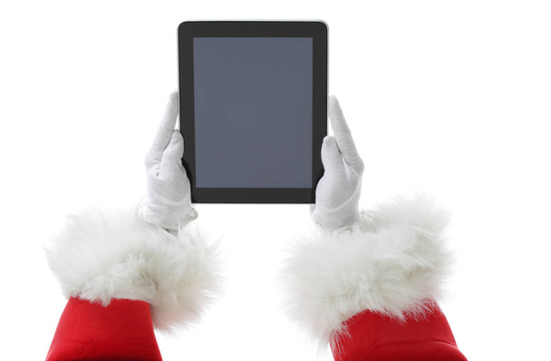 Christmas concept shot with Santa holding a digital tablet, showing it into the camera Isolated on white - Fotografie, Obrázek