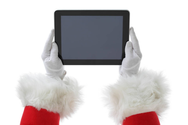 Natal tiro conceito com Santa segurando um tablet digital, mostrando-o na câmera Isolado em branco
 - Foto, Imagem
