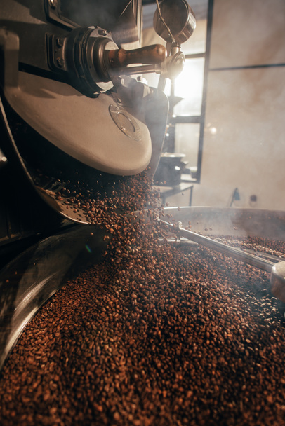 close up view of coffee beans roasting in machine - Photo, Image