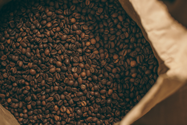 close up view of coffee beans in paper bag - 写真・画像