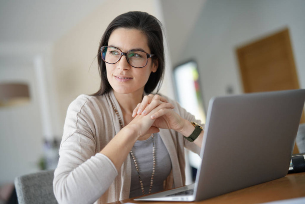 Home-office businesswoman looking at  window - Photo, image